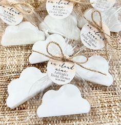 small white hearts tied with twine on burlock and jumbo bags for favors