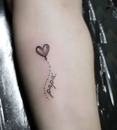 a heart shaped balloon with the word happy written on it's side tattoo design