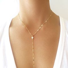 "This dainty chain lariat is adorned with a cubic zirconia accent. The cz drop hangs from the Y shaped chain This delicate necklace is great all by itself or combined with other necklaces for a dramatic layered look. Available in rose gold filled, gold filled, or sterling silver. Arrives gift wrapped! DETAILS & SIZE *The listing is for the coin lariat necklace *Available in our high quality 14K gold filled, rose gold filled or sterling silver chain and findings. *Drop from chain is 8\" in le Y Necklace Gold, Diamond Choker Necklace, Diamond Initial Necklace, Dainty Diamond Necklace, Gold Letter Necklace, Bracelets Design, Y Necklace, Diamond Solitaire Necklace, Dainty Chain