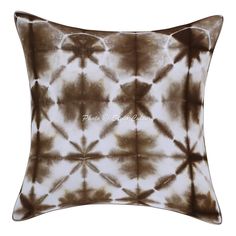 a brown and white tie dye pillow on a white background