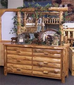 a large wooden dresser sitting next to a mirror