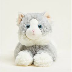 a gray and white cat stuffed animal with blue eyes