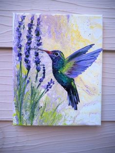 a painting of a hummingbird flying over lavender flowers