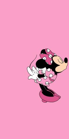 minnie mouse wallpaper with pink background and black and white polka dots on the ears