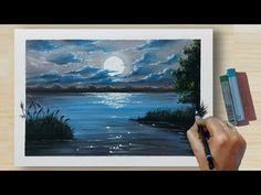 someone is drawing a landscape with watercolors