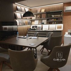 a dining room table with chairs around it and shelves on the wall behind it that have lights above them