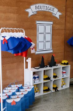 an image of a booth set up with hats and umbrellas on display for children's birthday party