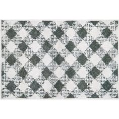 a white rug with black and grey squares on it