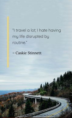 a winding road with a quote about travel