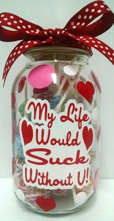 a jar filled with lots of candy and lollipops