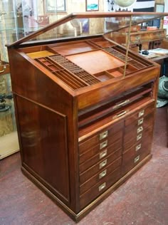 an old wooden desk with many drawers