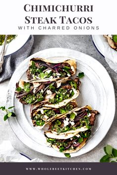 steak tacos on a white plate with green onions and feta cheese in the middle