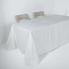 a white table with two chairs on it