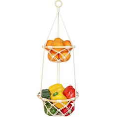 two baskets filled with fruit and vegetables on top of each other in front of a white background