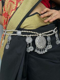 Oxidized silver kamarpatta waistbelt waist chain for women. The look is stunning and preciously suitable for all kinds of dressy occasions. The kamarband for women wedding is an amazing ethnic jewelry collection is ideal for wedding and also for all other traditional, casual and regular occasions that will add class and style to your look. A perfect gift for your daughter, mother, sister, friend, fiancée or bride. Silver-plated Light weight waist belt for your comfort. Trendy & Latest fashion. A Bohemian Silver Waist Chain As Gift, Elegant Silver Chain Belt For Festival, Bohemian Silver Body Chain As Gift, Bohemian Metal Waist Chain For Festivals, Traditional Waist Chain With Latkans For Festive Occasions, Traditional Festive Waist Chain With Latkans, Silver Bohemian Waist Chain For Festivals, Festive Waist Chain With Latkans For Festivals, Bohemian Silver Waist Chain For Festivals