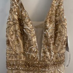 a dress with gold sequins on it