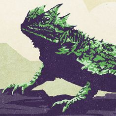 an image of a lizard that is green and black on the front, with mountains in the background