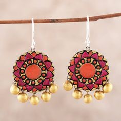 Handcrafted from sterling silver, two circles display hand-painted mandala motifs in hues of red and orange. Ritu Thapar designs these Indian earrings, which feature gleaming gold-tone baubles that dangle below. Each earring swings from a hook of sterling silver. Ceramic Chandelier, Mandala Motifs, Coaster Art, Terracotta Jewellery, Ceramic Earrings, Hand Painted Jewelry, Gold Ceramic, Ceramic Earring, Indian Earrings