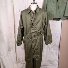 Great pair of US Army coveralls...cold weather mechanics coveralls from 1983. Features include: Nylon lining on the top portion Elastic gathered cuffs and pant legs Large rear pocket with Ideal zipper Heavy zipper front enclosure with snaps on the overlapping flap Built in elastic waistband Condition is very good. The fabric is free of holes and fraying and seems quite new. There are some white stainssee pic.  Please see all the pics to make the best decision on condition and look.  Men's size Medium Long Sleeve Overalls With Pockets For Outdoor, Military Style Long Sleeve Cotton Jumpsuit, Military Style Long Sleeve Khaki Jumpsuit, Khaki Military Long Sleeve Jumpsuit, Khaki Military Style Long Sleeve Jumpsuits, Military Style Long Sleeve Cotton Jumpsuits And Rompers, Khaki Long Sleeve Utility Overalls, Military Overalls With Pockets For Outdoor, Ariat Cowboy Boots Women