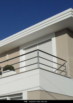 an apartment building with balcony and balconies