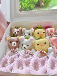 a box filled with lots of different types of stuffed animals in it's packaging