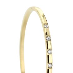 The SEQUENCE BANGLE which is made of Gold plated Stainless steel with seven Cubic zirconia and dimensions of 2.8" x 1.77". Lion Bracelet, Crystal Bangle, Quick Gifts, Cartier Love Bracelet, Eye Black, Gold Bangles, Chain Bracelet, Rhodium Plated, Necklace Set