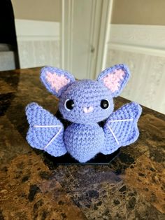 a crocheted stuffed animal sitting on top of a table