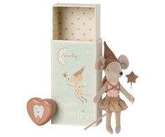 a toy mouse in a box next to a heart