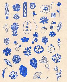 blue flowers and leaves are arranged on white paper