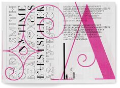 an open book with pink and black type on it