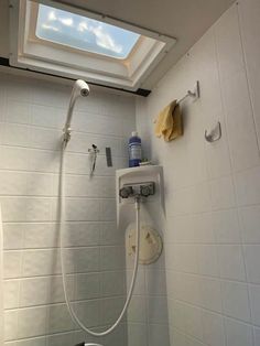 a shower with a skylight above it