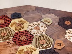 a close up of a wooden board game with numbers and symbols on the boards,