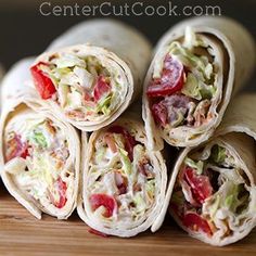 several wraps are stacked on top of each other and ready to be cut in half