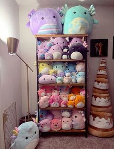 a shelf filled with lots of stuffed animals