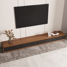 an entertainment center with a flat screen tv mounted on the wall and two planters next to it