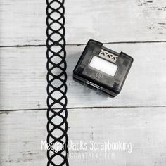 a black and white photo of an object on the ground with text overlay that reads, reason jacks scrapbooking