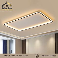 an image of a modern ceiling light in the middle of a room with beige walls