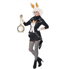 a woman dressed in rabbit costume holding a clock