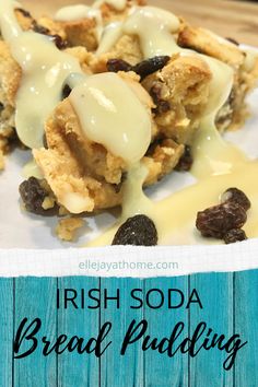 irish soda bread pudding with raisins on a white plate and blue wood background