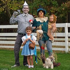 a family dressed up in costumes for halloween