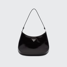 Prada hobo bag in brushed calf leather. Flat shoulder strap. Open top with snap closure. Enameled metal triangle logo. Interior, slip pocket. Nylon lining. "Cleo" is made in Italy. Prada Hobo Bag, Prada Hobo, Prada Cleo, Triangle Logo, Leather Hobo Bag, Leather Hobo, Open Top, Bergdorf Goodman, Back To Black