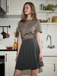 The pleats skirt that made of lightweight and cool material for spring and summer seasons. Featuring the cut-out detail at back, pleats detail, and the cinch belt that can adjust the size as you like. The classic charcoal color makes it easy to style with various tops. - Belt loops and metal logo brooch at waist- Cinch belt with 'D' rings at back that can adjust the size- Cotton patch at back- Pleated design throughout- Cut-out detail at back- Two kinds of lengths (short/long) available Pleated Gray Skort For Summer, Summer Pleated Gray Skort, Summer Gray Pleated Skort, Gray Fitted Pleated Skirt For Summer, Fitted Gray Pleated Summer Skirt, Fitted Gray Pleated Skirt For Summer, Gray Relaxed Fit Pleated Skirt, Gray Pleated Skirt For Spring Workwear, Spring Gray Pleated Skirt For Work