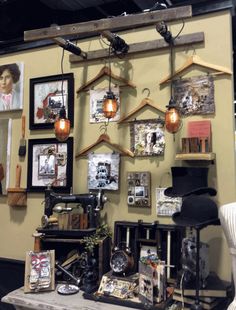 a room filled with pictures and lights hanging on the wall next to a sewing machine