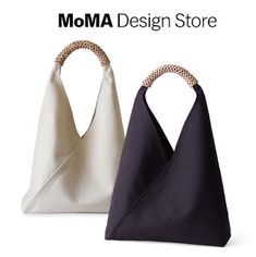 two bags with different designs on them and the words moma design store above it