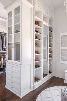 a white closet filled with lots of shoes