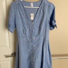 Gap Nwt Chambray Dress. This Dress Is Short And A Line, I Had To Crop Photo So It Doesn’t Show Length, But It Is A Short Dress With Cute Ties On The Arms For Some Reason The Picture Makes It Look Like There Is A Mark On The Dress, But There Are No Marks Or Flaws Gap Short Sleeve Mini Dress For Summer, Gap Short Sleeve Mini Dress, Fitted Cotton Mini Dress By Gap, Casual Short Sleeve Mini Dress By Gap, Gap Fitted Midi Dress For Summer, Casual Short Sleeve Midi Dress By Gap, Gap Fitted Short Sleeve Dresses, Fitted Short Sleeve Dresses By Gap, Fitted Gap Midi Dress For Summer