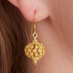 A beautiful romantic minaret filigree gold ball drop earring. These gold earrings are a crossover between boho and ethnic, but have an antique flavour that I love. Reminiscent of hot days in Morocco or an Indian Summer, I love the romance of these beautiful gold drops.  Dangly and fun, the intricate gold work and filigree has been worked by hand to create these atmospheric gold  ball drop earrings. You can wear these with flowing skirts, jeans and t-shirt , or all in white. The gold has a shine, but also a matt finish and really pops in the sunlight. All the materials I use are real Sterling Silver and 18 carat gold. I do not use inferior metals such as Gold fill or Brass Gold plated! Perfect for everyday, satisfyingly heavy, but light and easy to wear. These can be matched with anything i Gold Plated Earrings For Festive Gift, Gold Plated Earrings For Festive Season Gifts, Festive Gold-plated Earrings As Gift, Festive Gold Plated Earrings As A Gift, Festive Bridal Earrings For Gift, Elegant Gold Earrings With Latkans, Gold Temple Jewelry Earrings For Gift, Festive Gold Bridal Earrings For Pierced Ears, Festive Yellow Gold Earrings For Gift