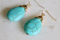 Turquoise drop earrings in minimal shapes for the right amount of a boho touch. Fun dangle earrings to add easy color and flair! Gold plated. Imitation turquoise. Fish hook backings. It comes nicely wrapped in tissue paper, sealed with a sticker, and ready to be gifted! All you need to do is put it in a gift bag. If you would like a handwritten note to be included in the package, just put your request in your order notes and I will make sure to include it! Affordable jewelry makes for a sweet gi Minimal Shapes, Dangle Earrings Boho, Turquoise Drop Earrings, Simple Photo, Earrings Turquoise, Jewelry Boho, Affordable Jewelry, Earrings Boho, Patterned Paper