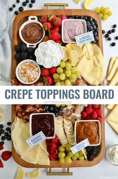 a wooden tray filled with different types of cheeses and toppings on top of it