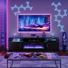 a living room with purple lighting and an entertainment center in the middle of the room